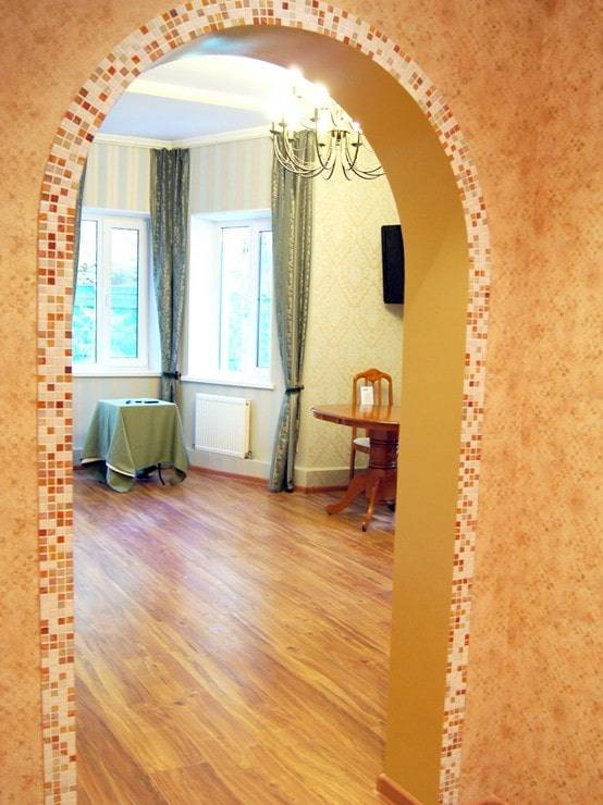 Отделка арки в квартире: варианты оформления с декоративным камнем, штукатуркой, уголком